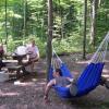 Mark relaxing at the best campground we found in the New (7/03)