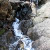 Mark figures out the easiest route up the waterfall